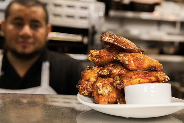 famous chicken wings, stacked